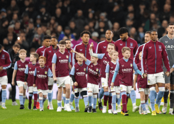 Aston Villa players walk on to the pitch