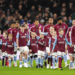 Aston Villa players walk on to the pitch