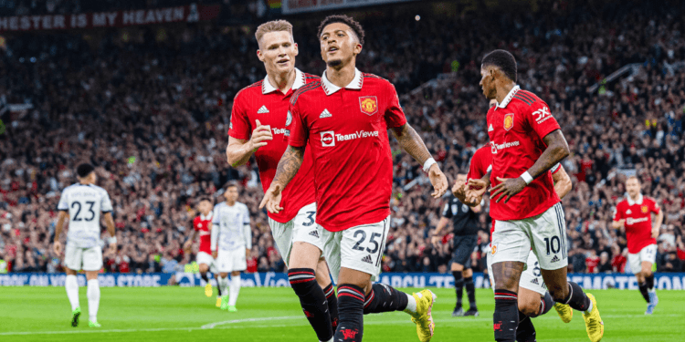 Manchester United's Jadon Sancho (Front) celebrates after scoring during a English Premier League match