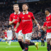 Manchester United's Jadon Sancho (Front) celebrates after scoring during a English Premier League match