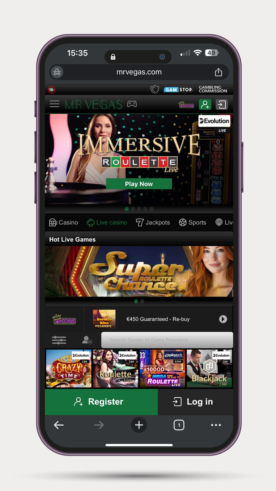 mr-vegas-mobile-live-casino-image Mobile view of Mr Vegas highlighting the Immersive Roulette live game, with a “Play Now” button. The Hot Live Games section showcases Super Roulette Chance followed by a carousel of live games including Crazy Time, Mega Roulette, and Blackjack. Bottom navigation includes search bar, register, and log in buttons.