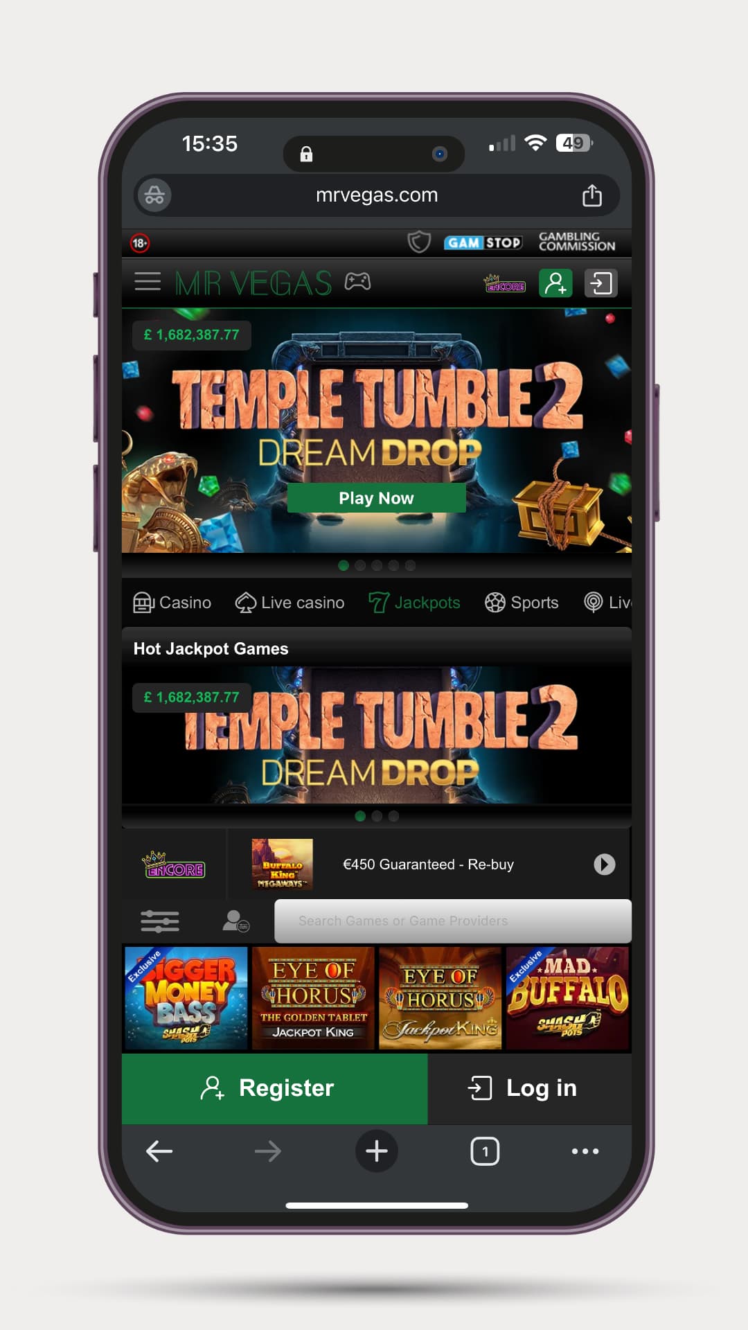 mr-vegas-mobile-slots-image Mobile view of Mr Vegas displaying the jackpot slot “Temple Tumble 2 Dream Drop” with a green ‘Play Now’ button and a visible jackpot amount of £1,682,387.77. Below are Hot Jackpot Games and a scrollable list of slot titles including Bigger Money Bass, Eye of Horus, and Mad Buffalo. A green register button and white log in icon appear at the bottom.